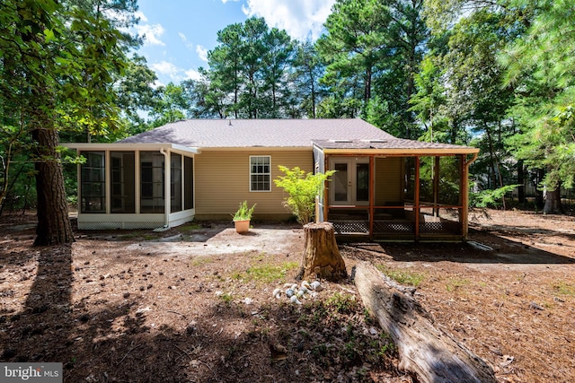 rear view of property with a sunroom