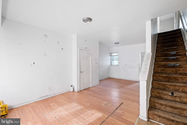 interior space with stairs and wood finished floors