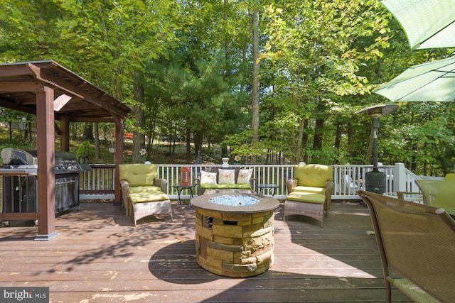 deck with a fire pit and a gazebo