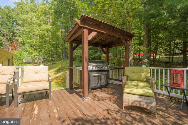 deck with grilling area and a gazebo