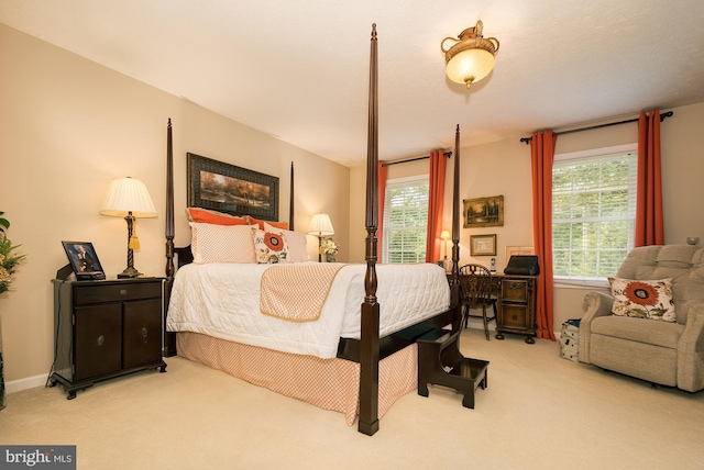 bedroom featuring light colored carpet