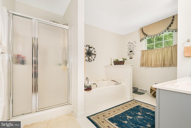 bathroom featuring vanity, separate shower and tub, and tile patterned floors