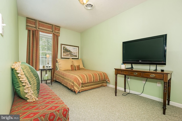 bedroom with light colored carpet