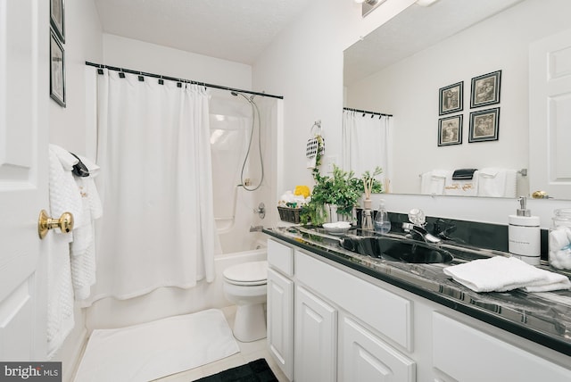 full bathroom with toilet, tile patterned floors, vanity, a textured ceiling, and shower / bath combo