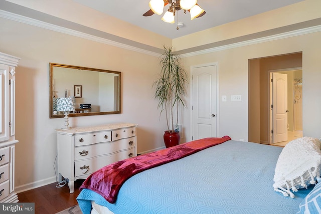 bedroom with a raised ceiling, ornamental molding, ceiling fan, wood finished floors, and baseboards