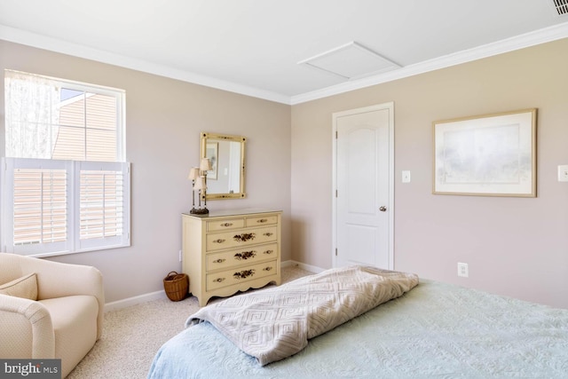 carpeted bedroom with attic access, ornamental molding, and baseboards