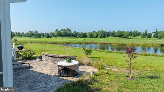 view of patio with a water view