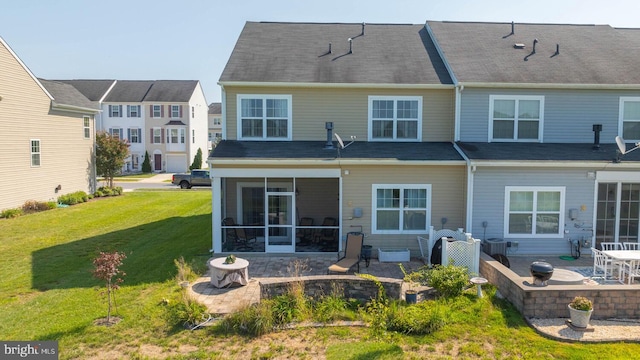 rear view of house featuring central air condition unit, a patio area, a lawn, and a sunroom