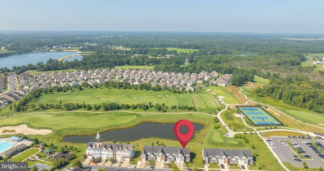 bird's eye view with golf course view, a water view, and a residential view