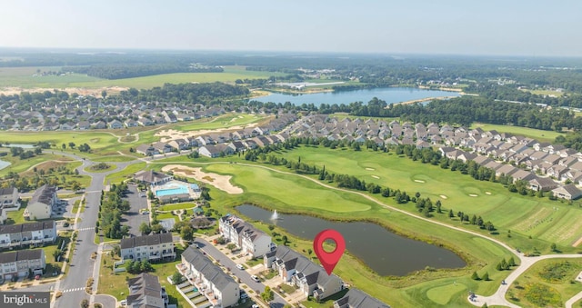 drone / aerial view with a residential view, a water view, and golf course view