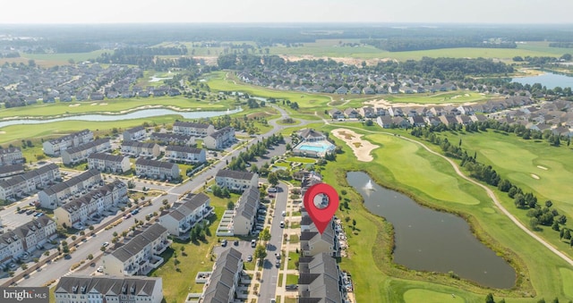 birds eye view of property featuring golf course view, a water view, and a residential view