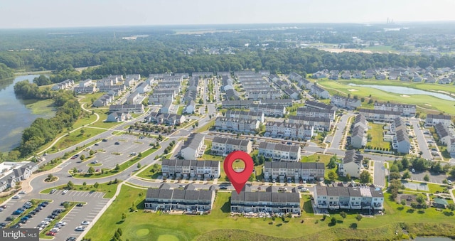 bird's eye view featuring a water view and view of golf course