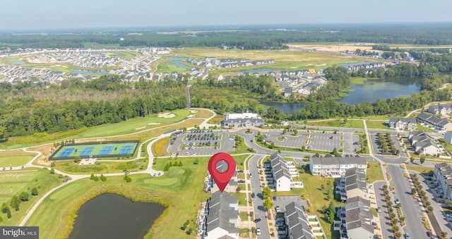 birds eye view of property with a residential view, a water view, and golf course view