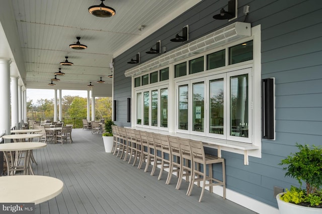 wooden deck with outdoor dining space