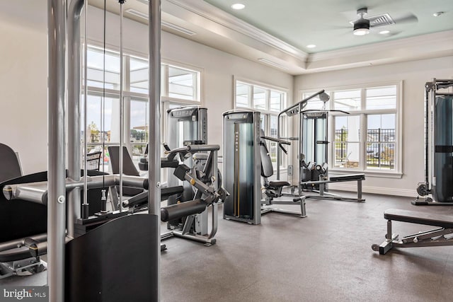 exercise room featuring crown molding, recessed lighting, a raised ceiling, visible vents, and baseboards