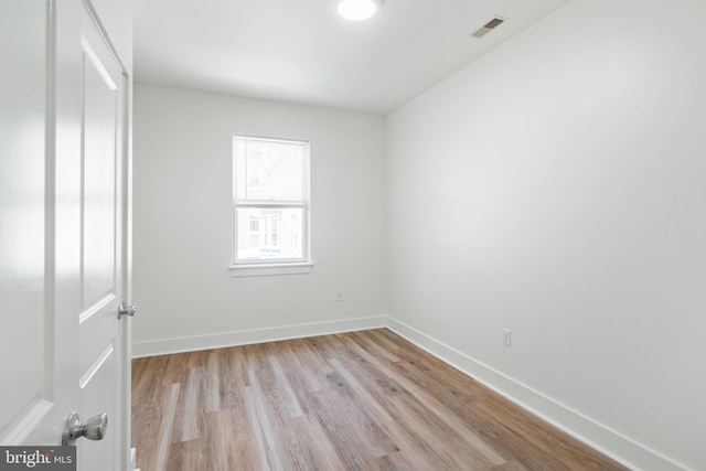 spare room featuring light hardwood / wood-style flooring