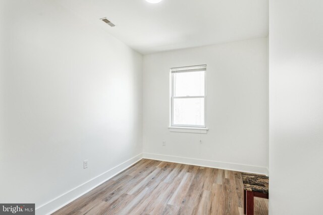 spare room with light wood-type flooring