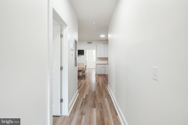 hallway with light wood-type flooring