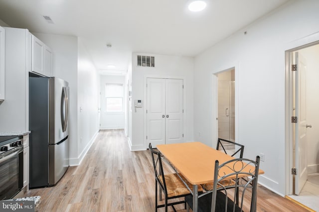 dining area with light hardwood / wood-style flooring