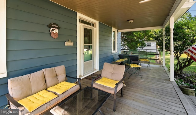 wooden deck featuring covered porch