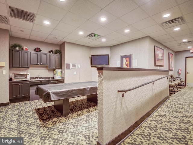 playroom featuring a sink and visible vents