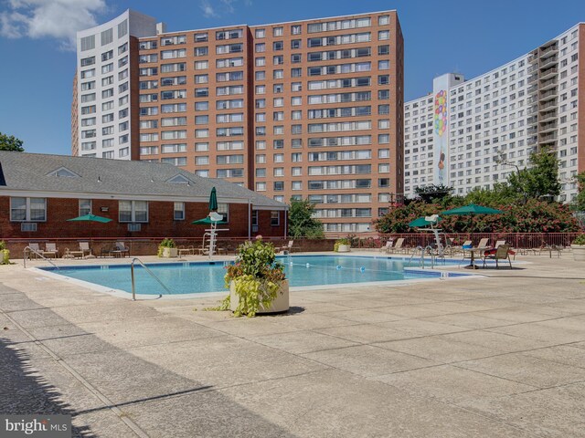 view of swimming pool with a patio area