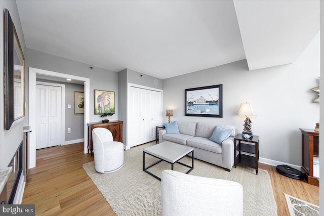 living room with light hardwood / wood-style floors