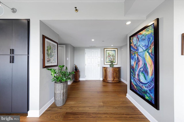 hall featuring elevator and dark wood-type flooring