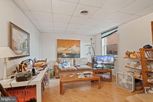 office area featuring light hardwood / wood-style flooring and a paneled ceiling