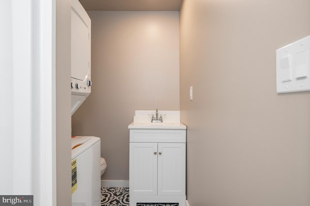 bathroom featuring vanity, toilet, and tile patterned flooring