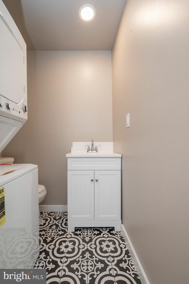 bathroom featuring vanity, toilet, and tile patterned floors