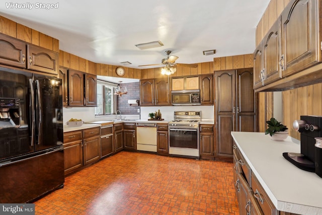 kitchen with black appliances, ceiling fan, and sink