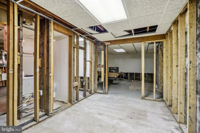 basement featuring a paneled ceiling