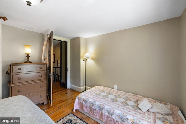 bedroom featuring light wood-style flooring