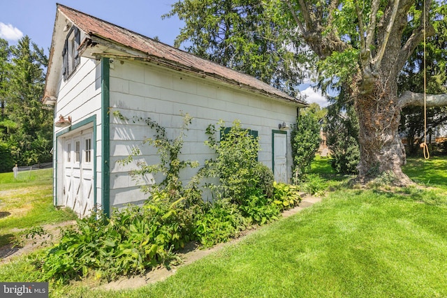 view of side of home featuring a yard