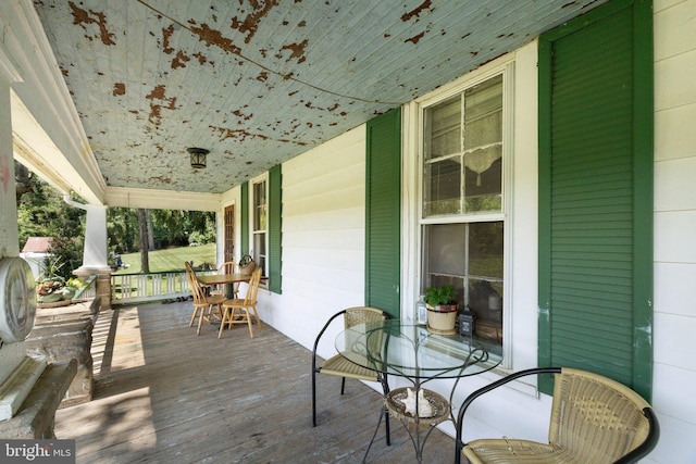 wooden terrace with covered porch