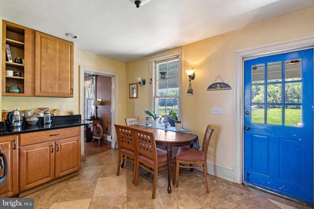 dining space with light tile patterned floors and washer / clothes dryer