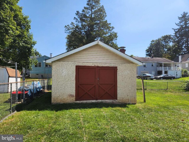 view of shed with fence