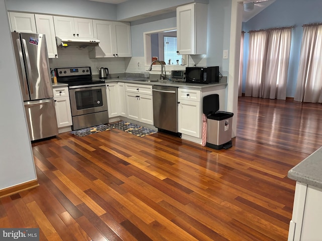 kitchen with appliances with stainless steel finishes and white cabinetry