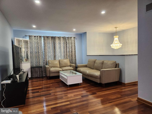 living area featuring baseboards, visible vents, dark wood-type flooring, and recessed lighting