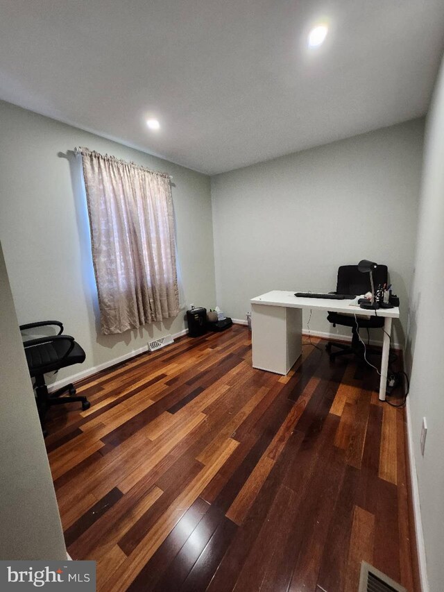 empty room with a paneled ceiling and light tile patterned floors