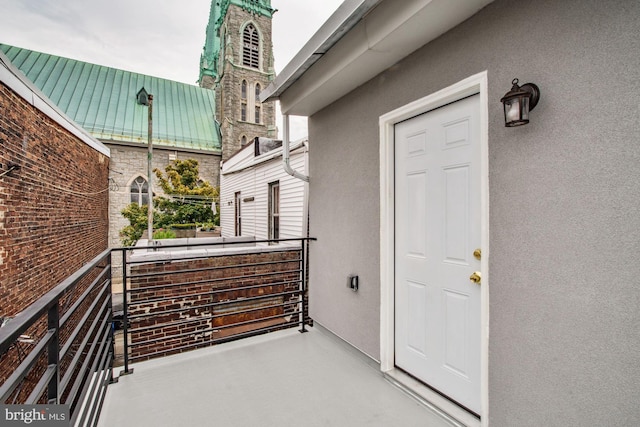 entrance to property with a balcony