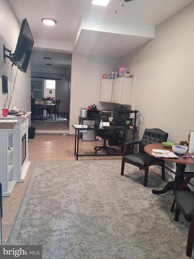 home office with light tile patterned floors