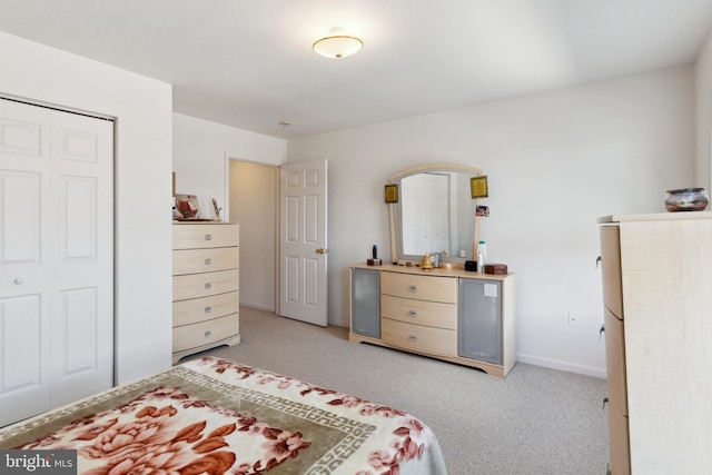 carpeted bedroom featuring a closet