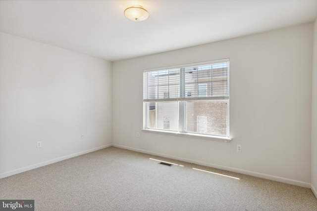 spare room featuring carpet flooring