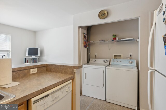 laundry room featuring separate washer and dryer