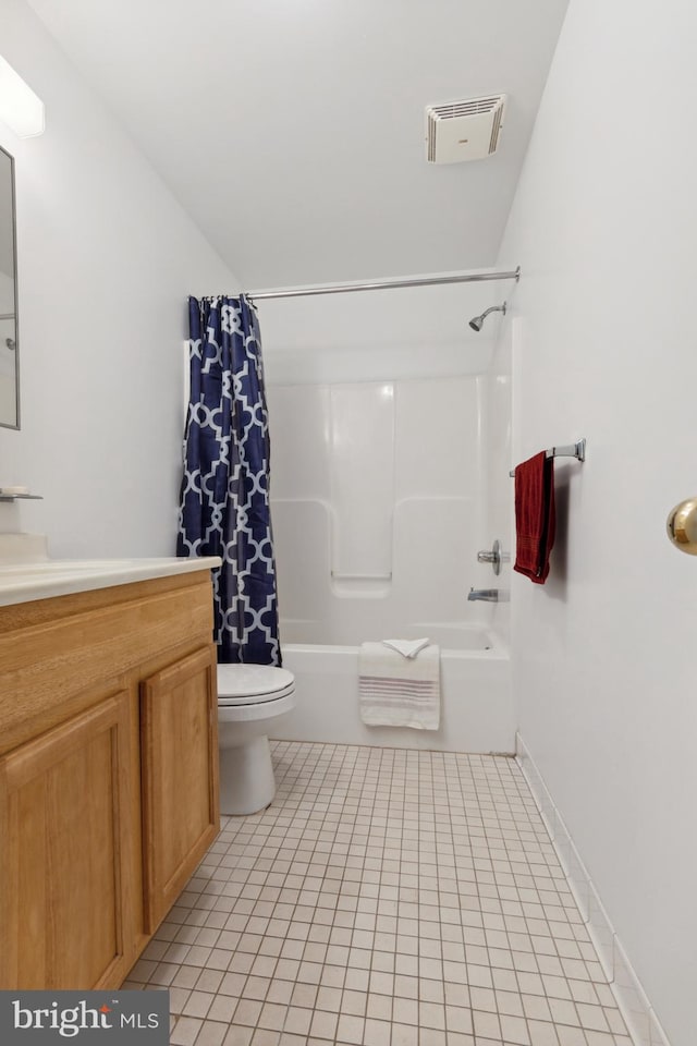 full bathroom featuring vanity, toilet, tile patterned floors, and shower / bath combo