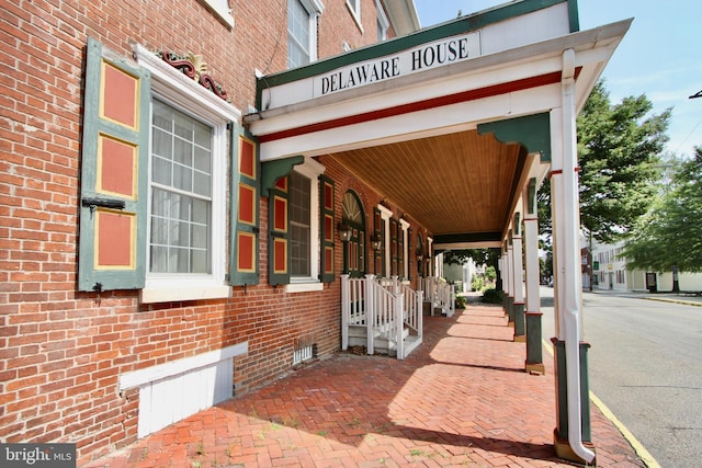 exterior space featuring brick siding