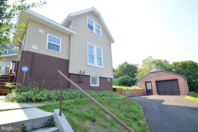 view of front facade with a garage and an outdoor structure