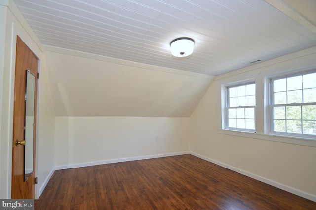 bonus room with vaulted ceiling, wood finished floors, visible vents, and baseboards